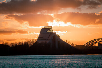 Latvian National Library or Castle of Light at sunset in Riga. Pinacle of modern architecture located right next to river Daugava