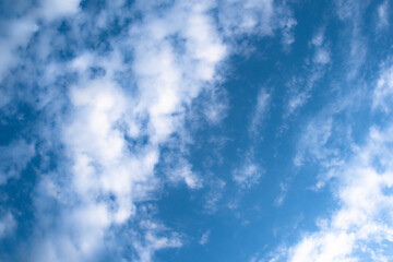 Picturesque clouds in blue sky on sunny day