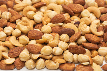 Mix of nuts isolated on white background. Top view.