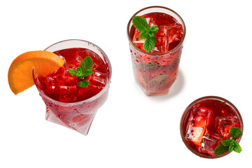 Red fresh drink with ice, grapefruit and mint isolated on white. Space for text or design.