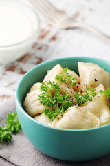Russian national dish pelmeni served in a plate
