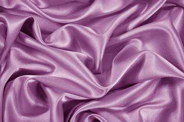 Lilac satin silk background. Soft wavy folds of delicate shiny fabric. Beautiful pink purple background for design. Web banner. Valentine's day, wedding, anniversary, celebration, romance, concept.