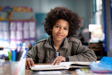 African American boy studying in classroom