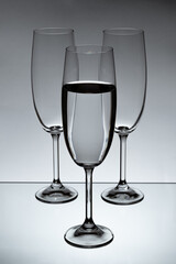 3 Glasses of water, with one full and 2 empty