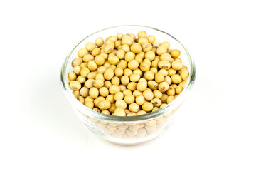 Soybeans in transparent bowl isolated on white background. Soy contains nutrients that are beneficial to the body. But there are also allergens.