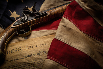 Flintlock pistol with American flag and Declaration of Independence