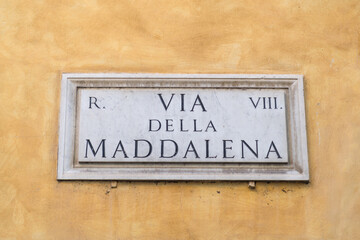 Street sign in Rome, marble plate on street wall with te writing : "Via della Maddalena