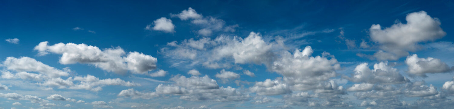 White cumulus clouds on blue sky