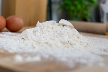 Flour on the table prepared for kneading pasta dough