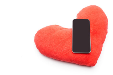 Big red toy heart at smart phone like symbol icon followers from social network isolated on white...