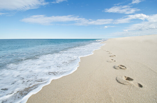 United States, Massachusetts, Cape Cod, Nantucket Island, Footprints on empty beach