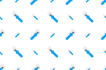 Background from a metal adjustable wrench with a rubber handle. Tools seamless pattern.