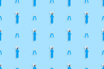 Tools seamless pattern. Background made of tools, pliers and an adjustable wrench.