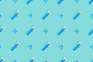 Fototapeta premium Tools seamless pattern. Background made of tools, pliers and an adjustable wrench.