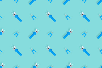 Tools seamless pattern. Background made of tools, pliers and an adjustable wrench.