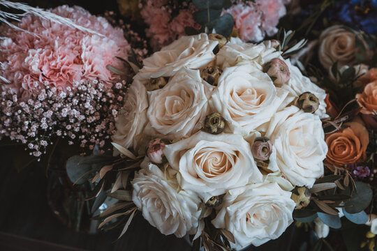Beautiful Biedermeier bouquet made out of cream white roses and buttercups 