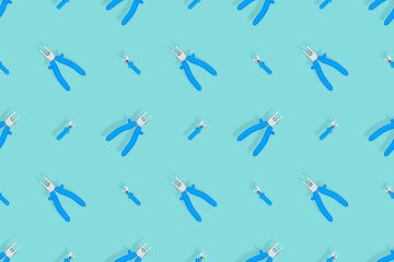 Tools seamless pattern. Background made of tools, pliers and an adjustable wrench.