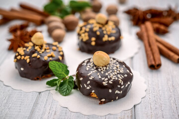 Delicious chocolate cakes on table close-up, with nuts