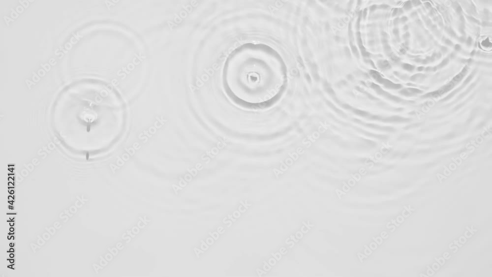 Poster up close, top view, slow motion various waves of the water surface hitting the sun's rays, making th