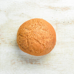 Bakery- fresh rolls for a burger. Baking from rye and flour. Top view. Rustic style.