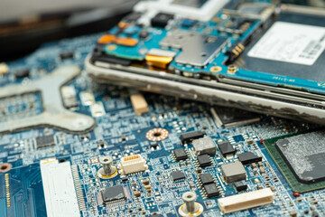 technician repairing inside of hard disk by soldering iron. Integrated Circuit. the concept of...
