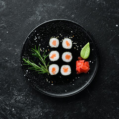 Sushi maki with salmon. Pieces of delicious sushi. Japanese cuisine