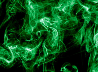 Green smoke isolated on black background. Abstraction