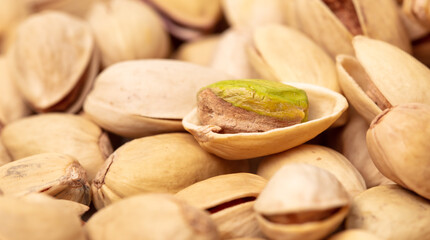 Close-up of fresh pistachio nuts as background.