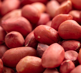 Close up of peanut nuts as background. Macro