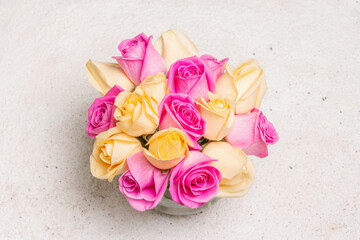 Bouquet of fresh multicolored roses in a vase