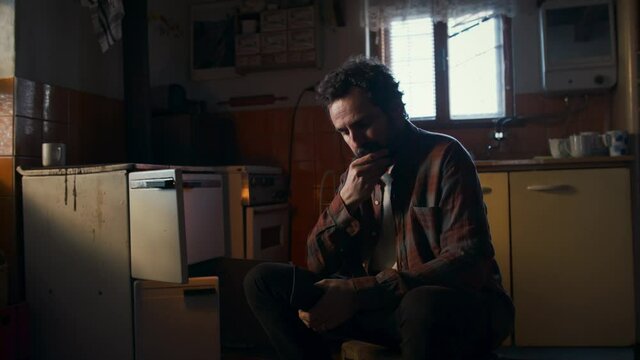 Poor mature man with empty wallet indoors at home, poverty concept.