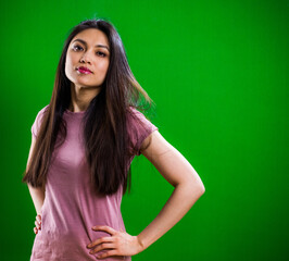 Young pretty woman posing for the camera in a studio - studio photography