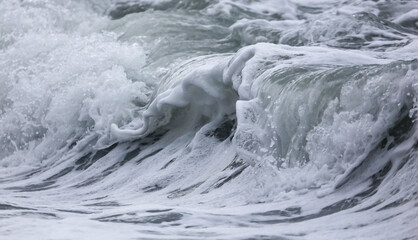 Wave in the sea with splashing water.