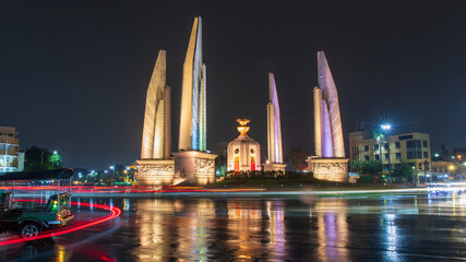 Night time wtih rain water at Democracy Monument at night in Bangkok, Thailand.