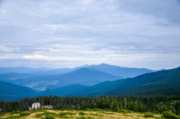 View from the mountain to the ski resort Dragobrat. Hoverla and petros mountines on background. Carpathian mountains, Ukraine