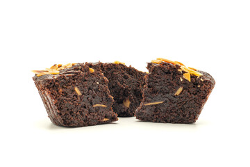 Pieces of fresh brownies on white background. Close-up photo. Delicious chocolate pie. Dessert and relaxation concept