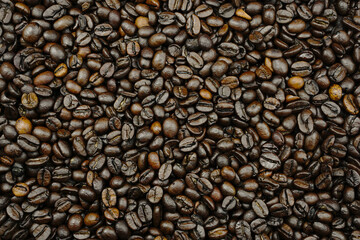 Roasted dark coffee beans background.