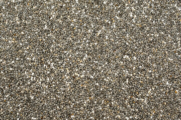 Chia seeds top view. Uncooked dry chia seeds background.