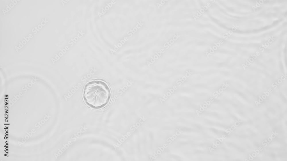 Poster up close, top view, slow motion various waves of the water surface hitting the sun's rays, making th