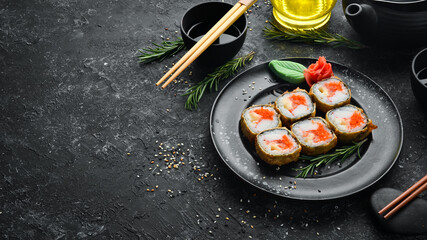 Sushi with crab and caviar cooked in oil. Sushi menu of Japanese restaurant. Top view.