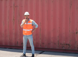 Portrait of a handsome engineer under inspection and checking production process on dock station...
