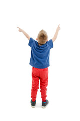 Back view of little boy points at wall. Rear view. Isolated on white background 
