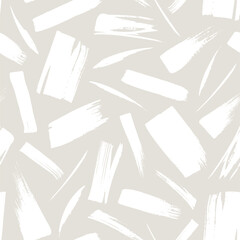 Abstract seamless pattern with white hand drawn brushstrokes isolated on gray background.
