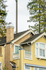 The top of the house or apartment building with nice window.