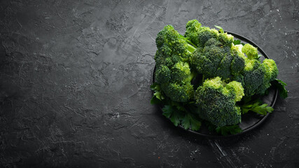 Fresh green broccoli on dark old background. Top view. Free space for your text.