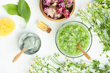 Refreshing handmade cucumber and clay mask. Self care, home face and body treatment durine lockdown. Concept of natural organic ingredients, essential oil in cosmetics. Zero waste. Flat lay top view