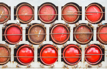 Red compressed propane gas bottles are safely transported and stored in dedicated industrial equipment