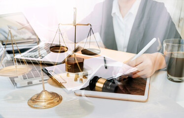 Business and lawyers discussing contract papers with brass scale on desk in office. Law, legal services, advice, justice and law concept picture with film grain effect