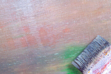 abstract colored creative background - rough linen canvas unevenly covered with multi-colored...