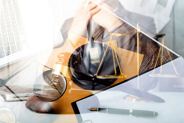 Business and lawyers discussing contract papers with brass scale on desk in office. Law, legal services, advice, justice and law concept picture with film grain effect